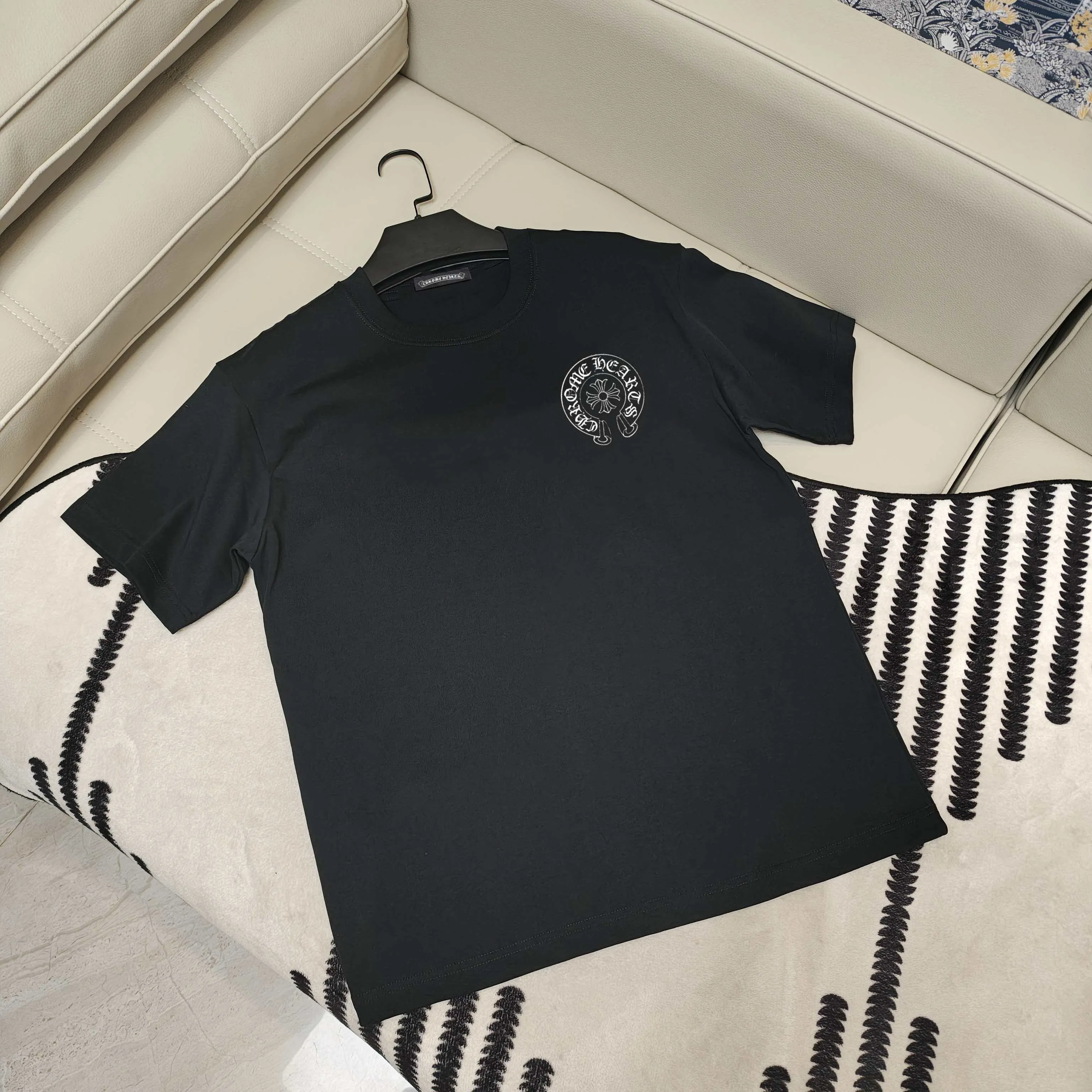 🅿️190 Crow Heart’s new summer T-shirt! This Sanskrit cross printed round neck short sleeves is simply a must-have for fashionistas. Salona cotton fabric is super comfortable, soft and skin-friendly, and has excellent breathability, making it perfect for summer wear. The Sanskrit cross print design on it is amazing, full of mystery and high-end, and the details are so exquisite that it makes people scream. It is worthy of Kroxin, and it vividly interprets the trend and personality. The loose fit is super friendly to all body shapes, covers the flesh and is comfortable, and looks good no matter how you wear it. Pair it with jeans and you'll look cool on the street. Pair it with sweatpants and you'll instantly look energetic and trendy. When you wear it and go out, you will feel like you are the spokesperson of fashion, and it will definitely turn heads. Color: black, white Size: S-2XL